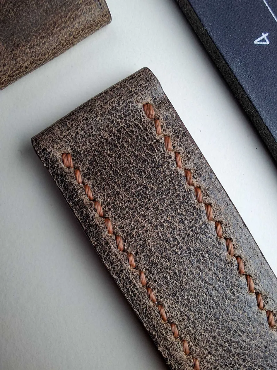 aniline vintage distressed brown strap closeup aniline vintage distressed brown strap closeup
