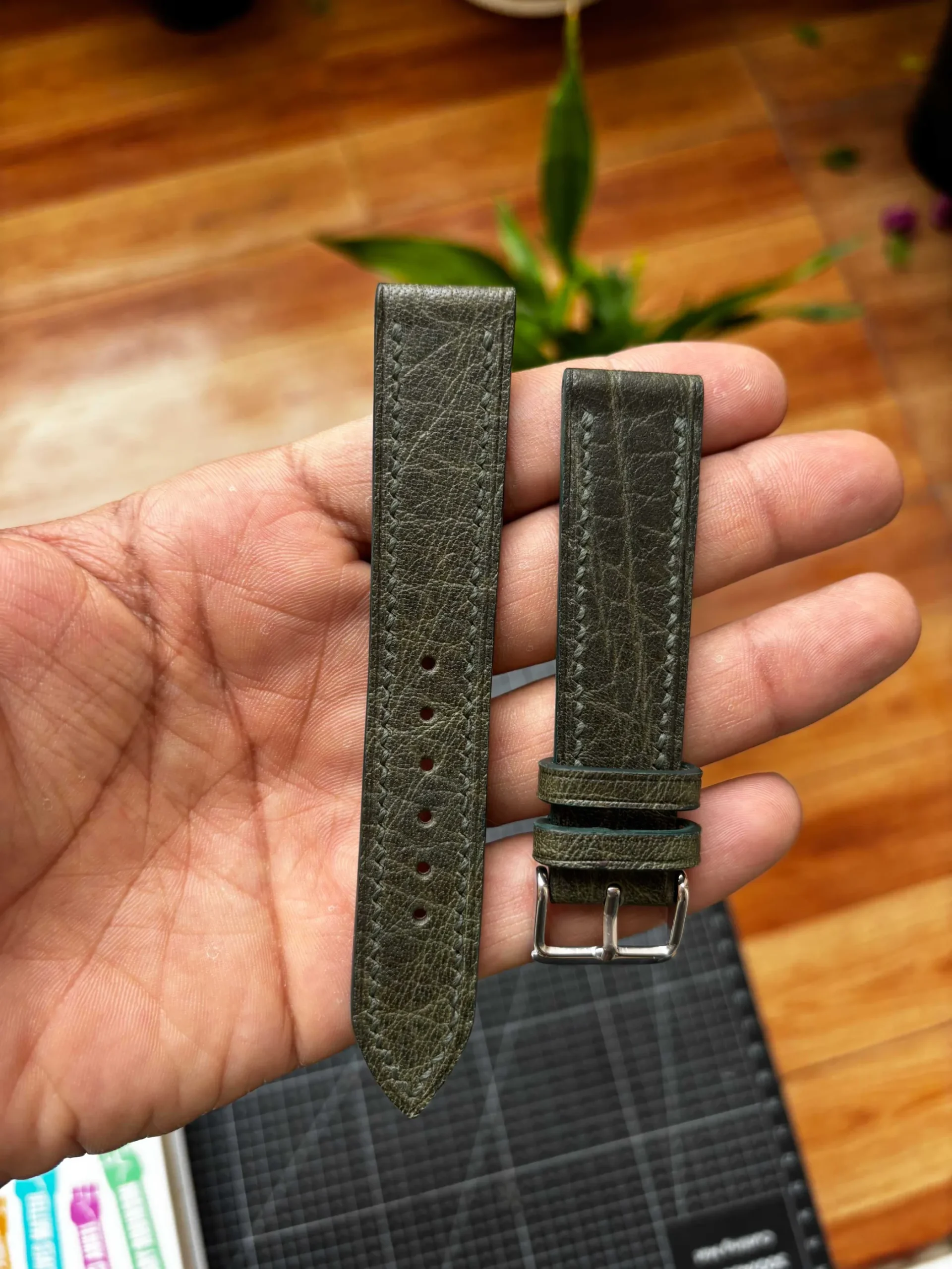 Cassido Green Waxy Signature Strap Nakshara buckle worn on wrist