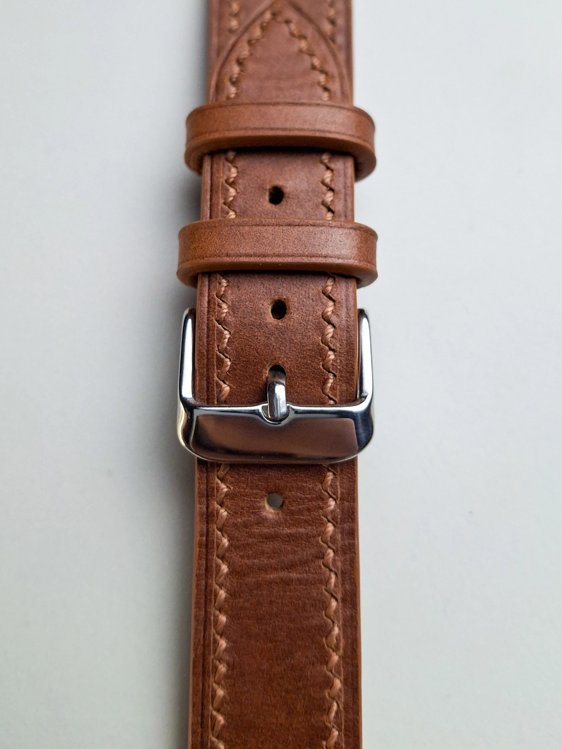 polished signature buckle closeup polished signature buckle closeup