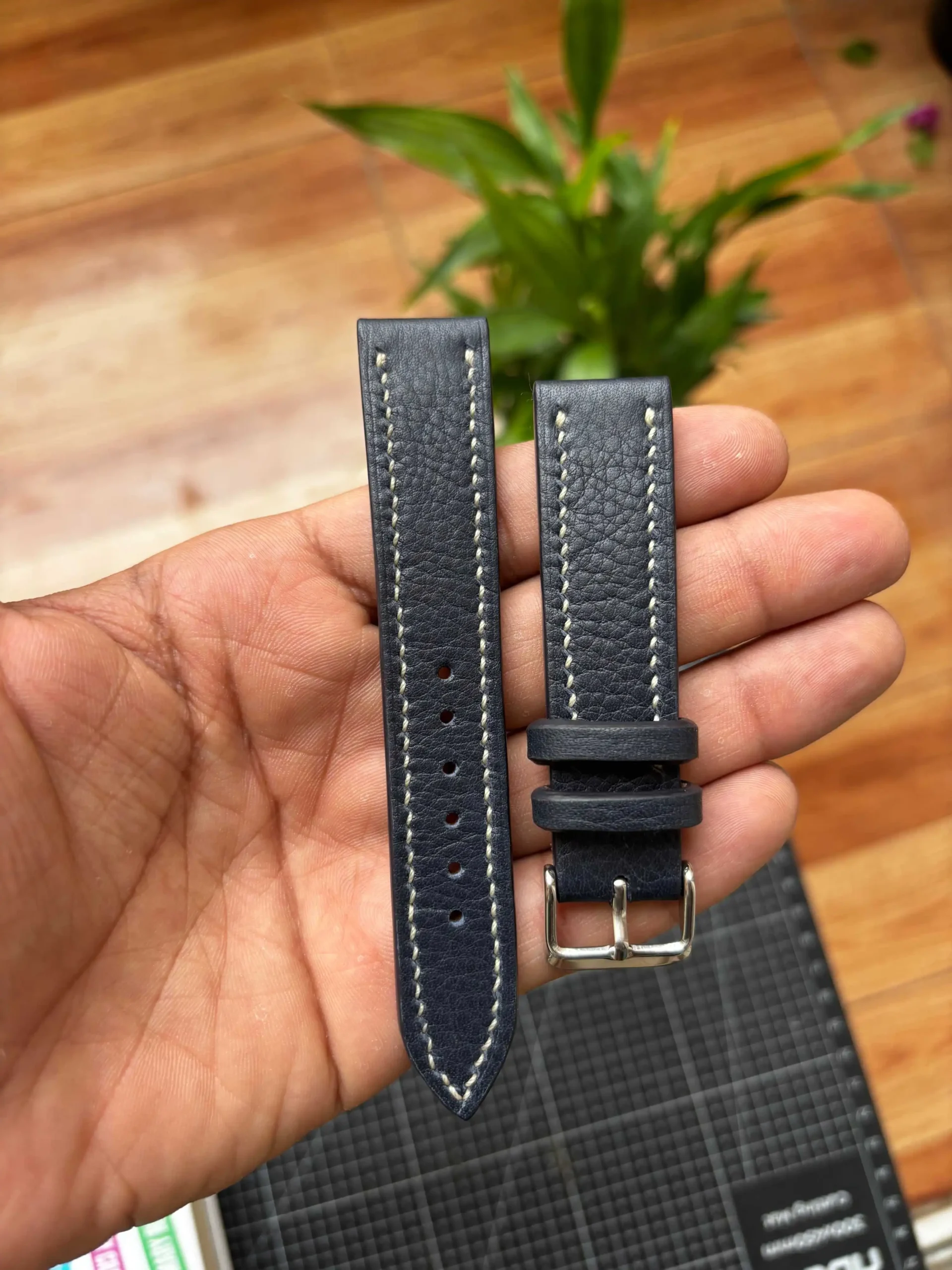 Navy Blue Togo Leather Strap Nakshara buckle worn on wrist