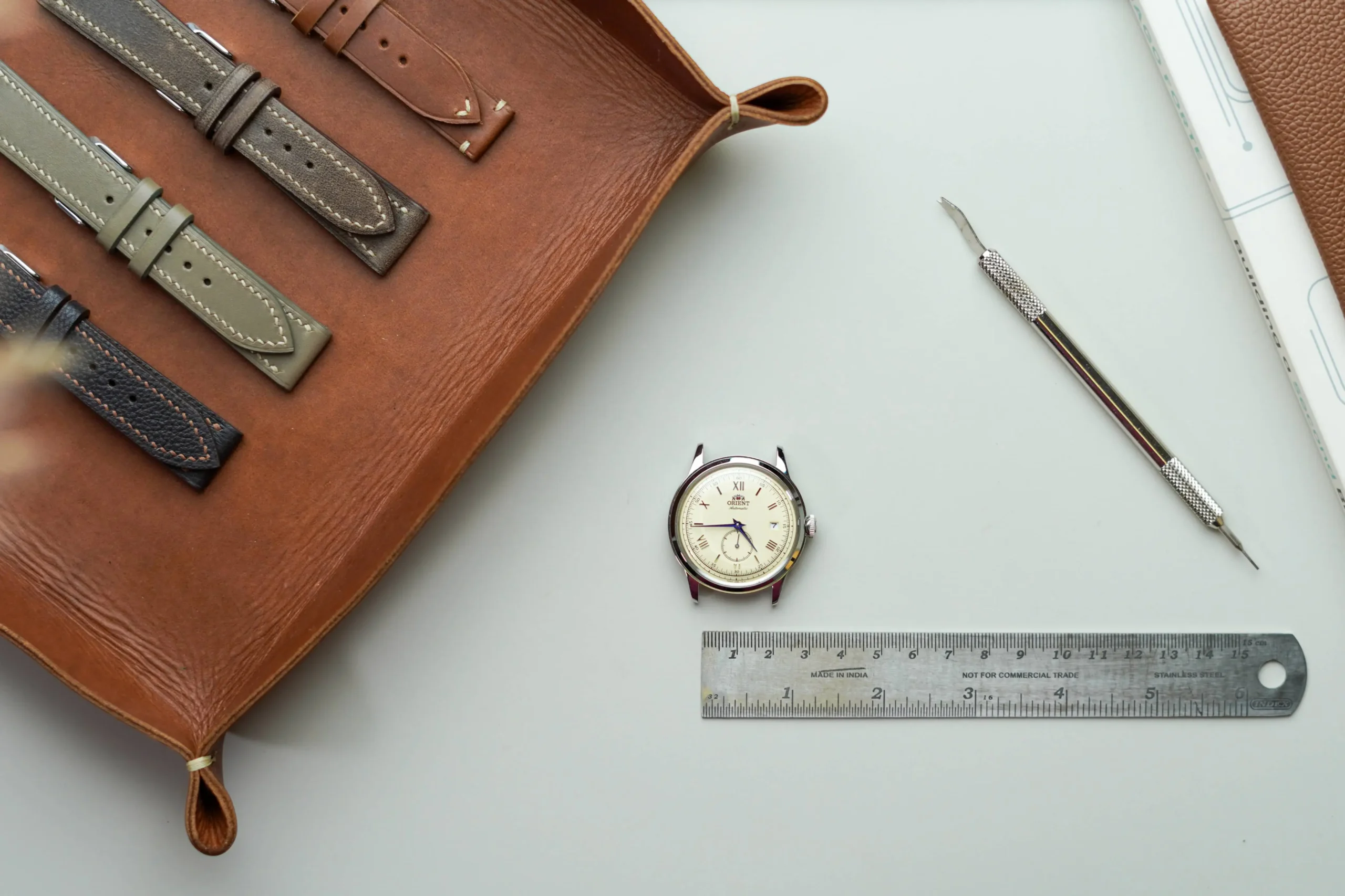 Hands Measuring A Watch Lug With Scale Scaled