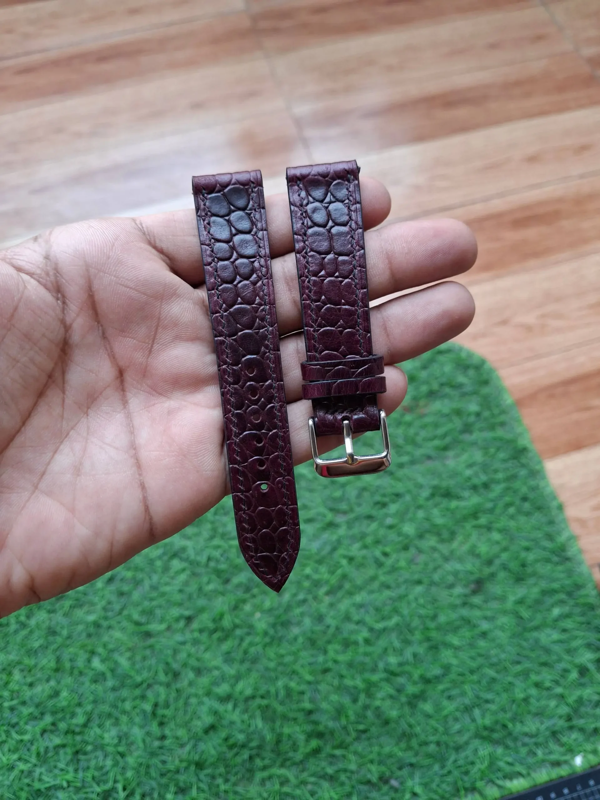 Antares Croco-Embossed Round Pattern Nakshara buckle worn on wrist