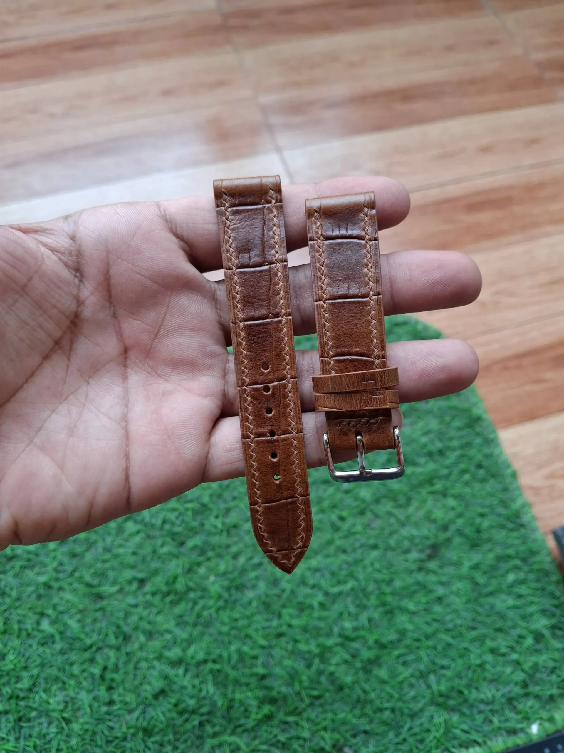 Brown Croco-Embossed Strap Nakshara buckle worn on wrist